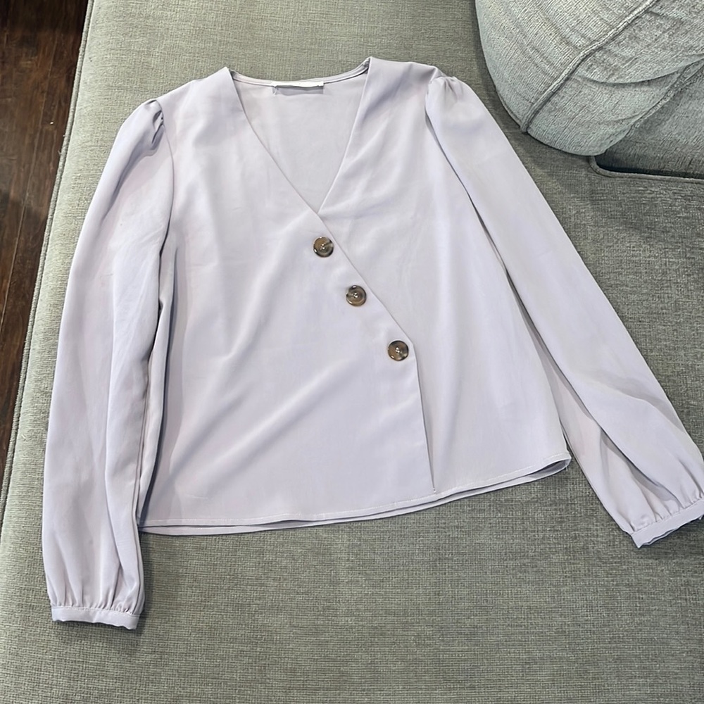 Lavender colored size medium. Cute button detail with.